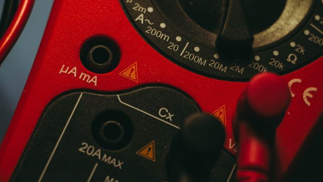Close-up of a multimeter dial during electrical troubleshooting