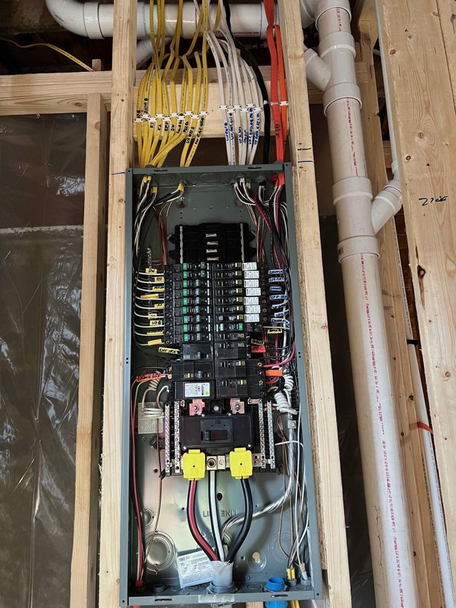 New electrical panel and branch wiring in an open stud wall